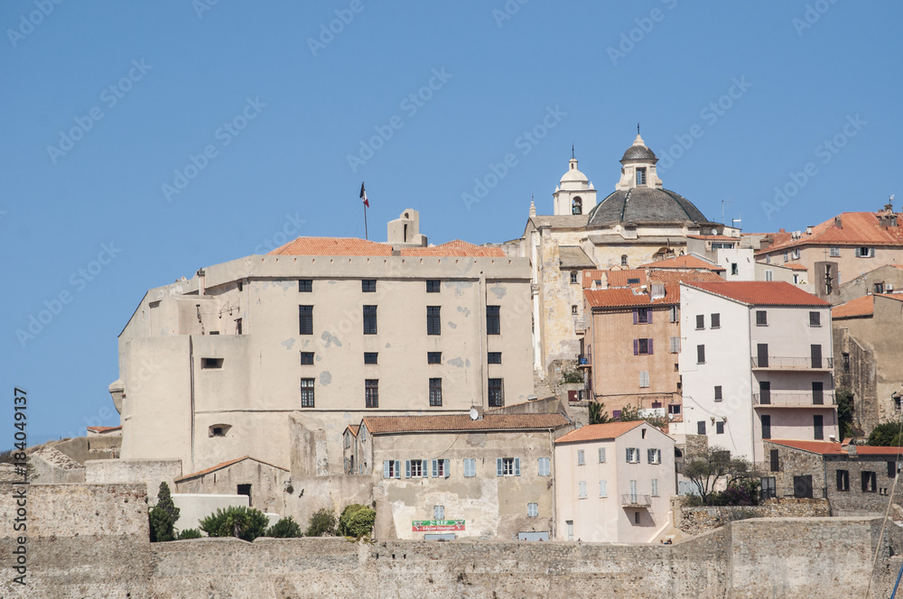 Corsica, 03/09/2017: vista dello skyline dell'antica Cittadella di Calvi, famosa meta turistica sulla costa nord ovest dell'isola, con le sue antiche mura e i campanili delle chiese