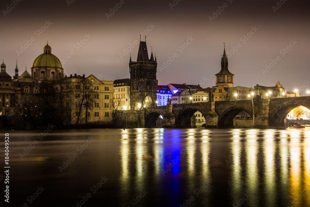 Charles bridge in Prague with lanterns at night