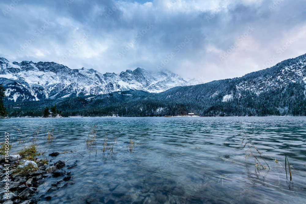 View of the famous Eibsee with alpine mountains in the background