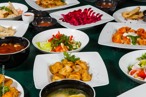 dishes with different food on the table.