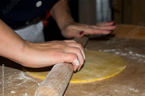 Hands Making A Knead With Flour And Eggs Preparing An Italian Traditional Food Called Strufoli photo