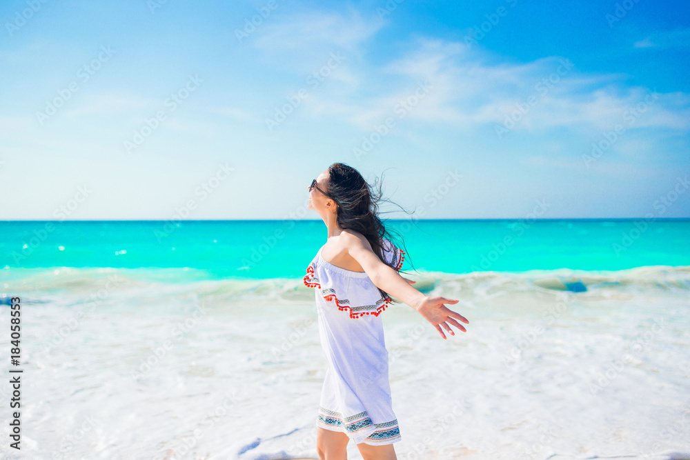 Young beautiful woman relax on white tropical beach Young beautiful woman relax on white tropical beach
