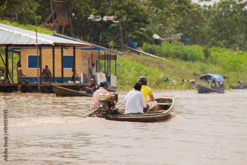 People leaving the village of Leticia by boat over the amazon river
