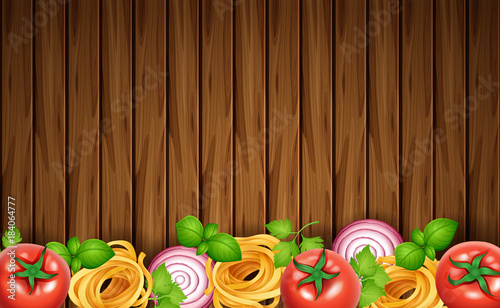 Wooden board with pasta and fresh vegetables