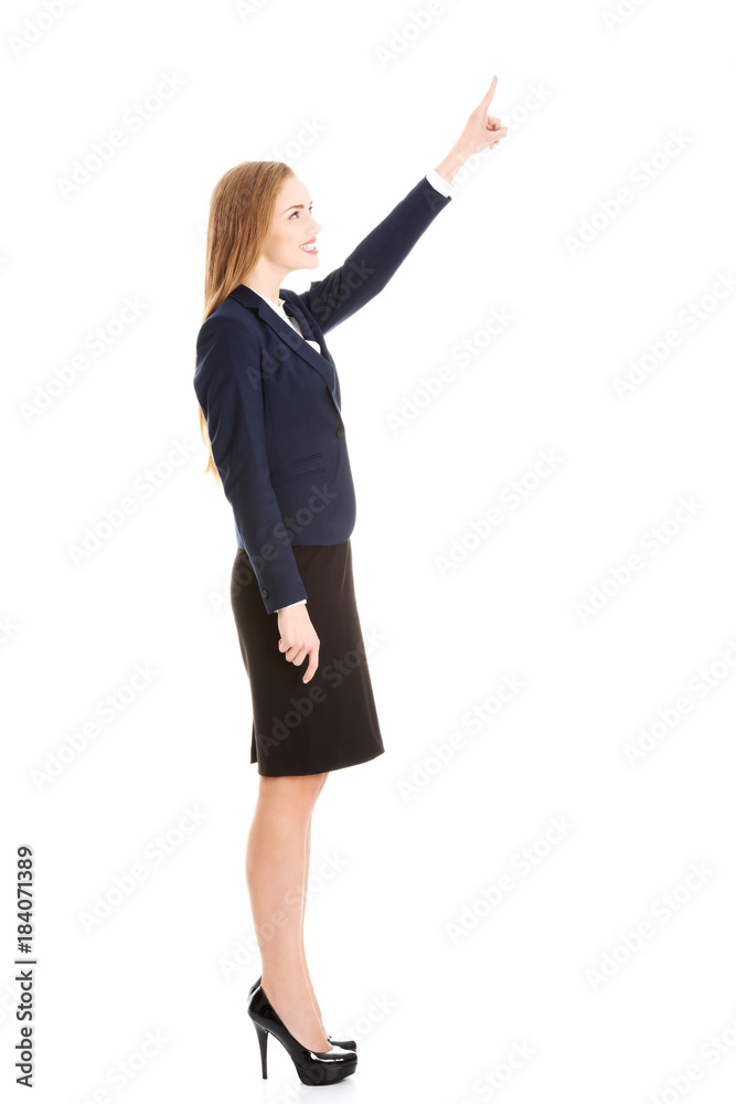 Beautiful business woman pointing on copy space. Beautiful business woman pointing on copy space.