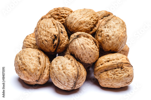 pile of walnuts isolated on white background