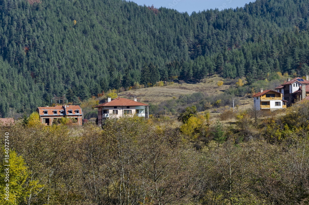 Scene with mountain top, valley, forest, glade and residential district of bulgarian village Beli Iskar, Rila mountain, Bulgaria Scene with mountain top, valley, forest, glade and residential district of bulgarian village Beli Iskar, Rila mountain, Bulgaria
