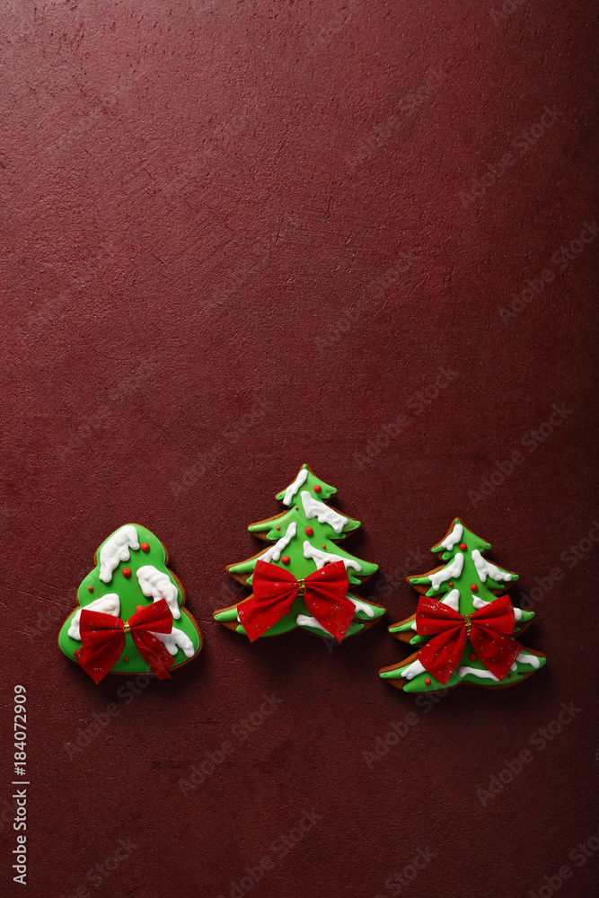 Christmas trees on red holiday background