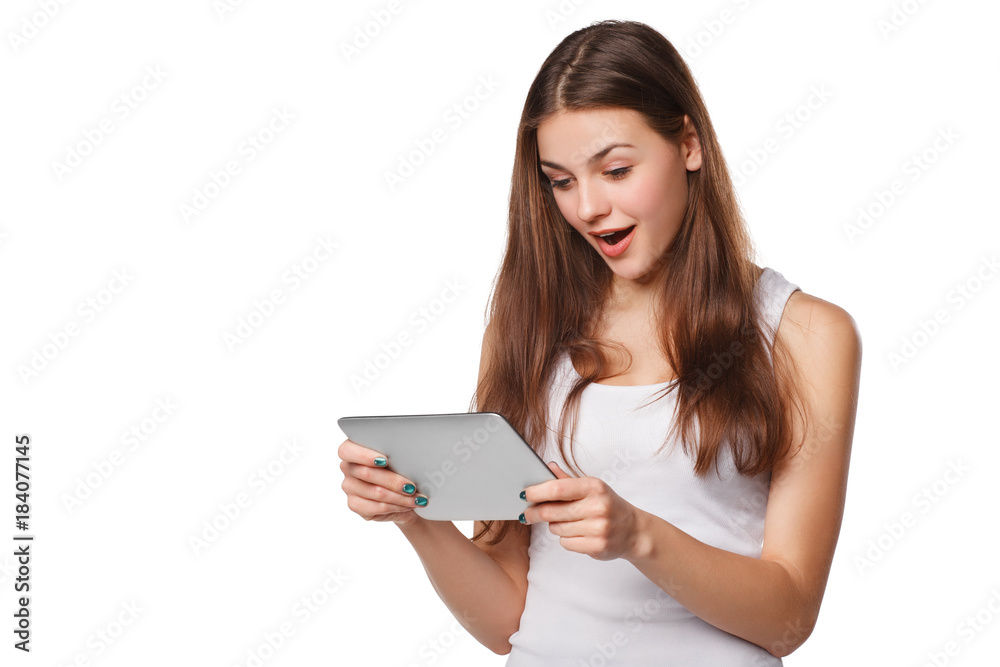 Happy girl using tablet. Excited woman with tablet pc, isolated on white background Happy girl using tablet. Excited woman with tablet pc, isolated on white background