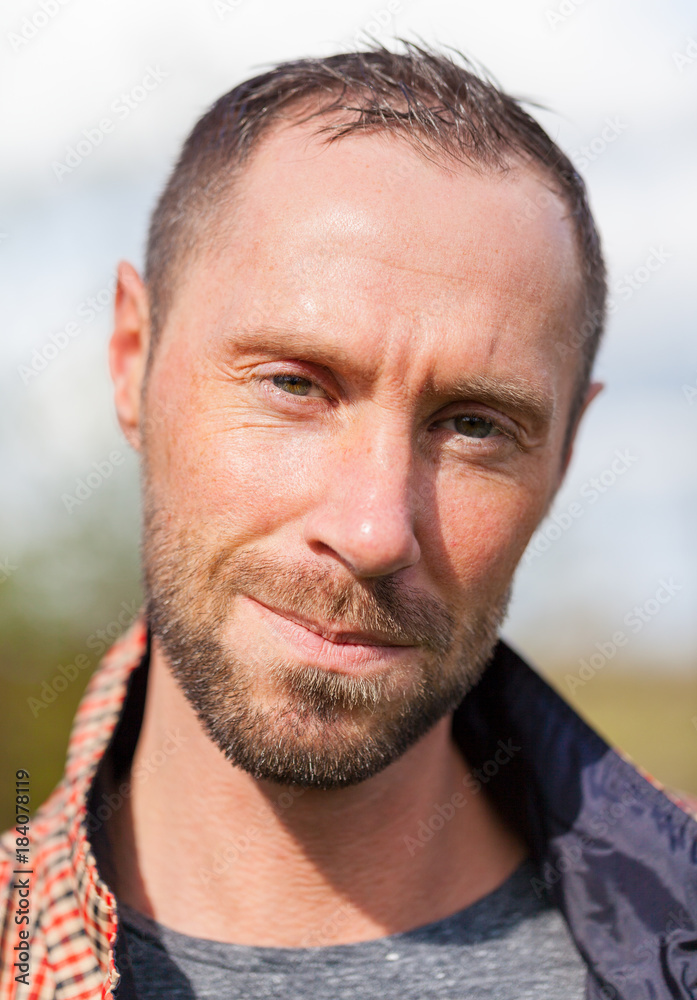 young man with checkered jacket portrait