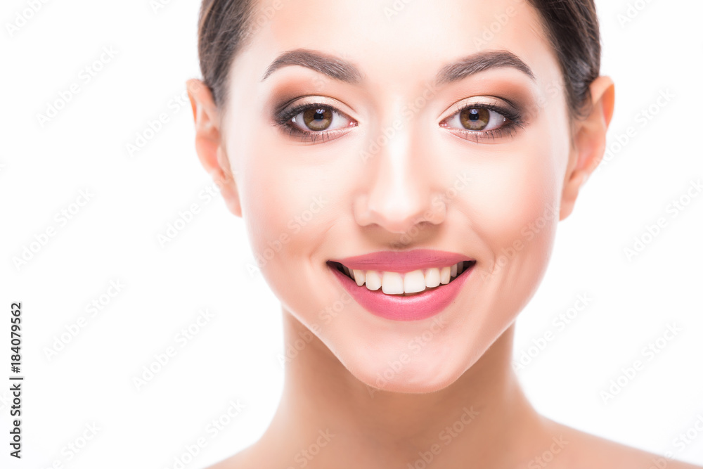 Beautiful Face of Young Woman with Clean Fresh Skin close up isolated on white. Beautiful Spa Woman Smiling. Perfect Fresh Skin. Pure Beauty Model. Youth and Skin Care Concept Beautiful Face of Young Woman with Clean Fresh Skin close up isolated on white. Beautiful Spa Woman Smiling. Perfect Fresh Skin. Pure Beauty Model. Youth and Skin Care Concept