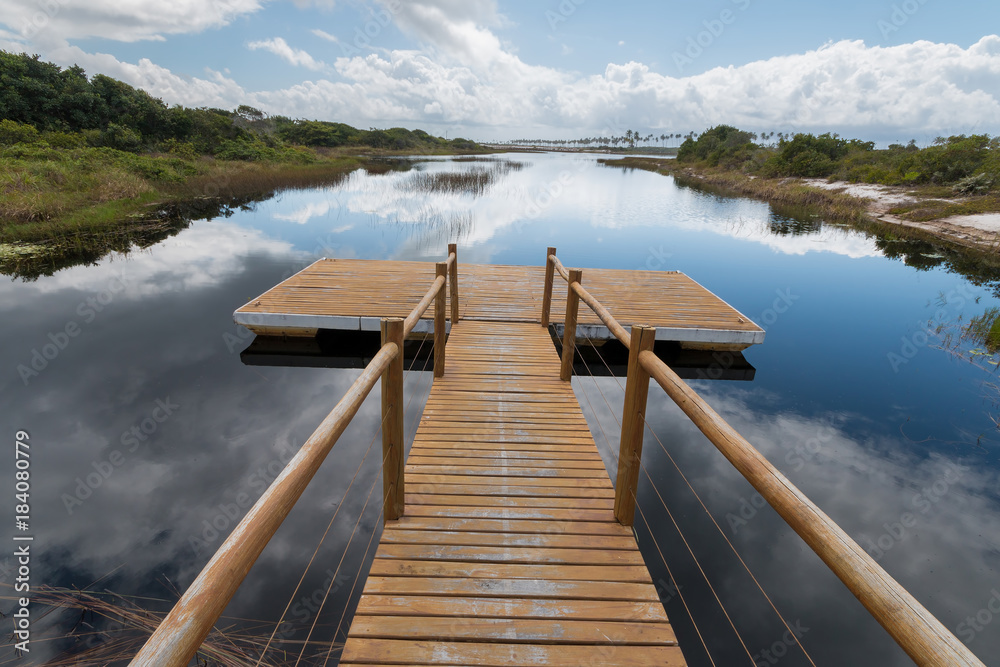 Naklejka premium Landscape with pier in the lake on the Brazilian coast