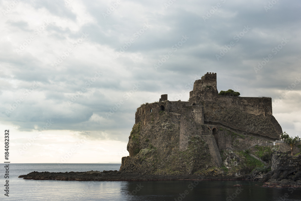 Castle of Aci Catello with cloudy sky - Sicily