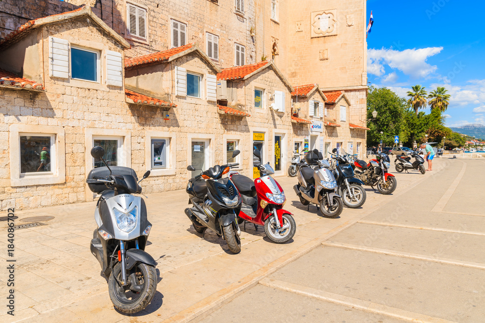 TROGIR TOWN, CROATIA - SEP 6, 2017: scooters parking in old town of Trogir on sunny summer day, Dalmatia, Croatia.