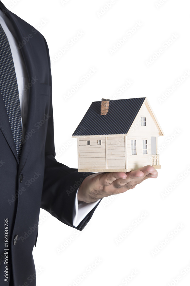Hand of the businessman with the house Hand of the businessman with the house