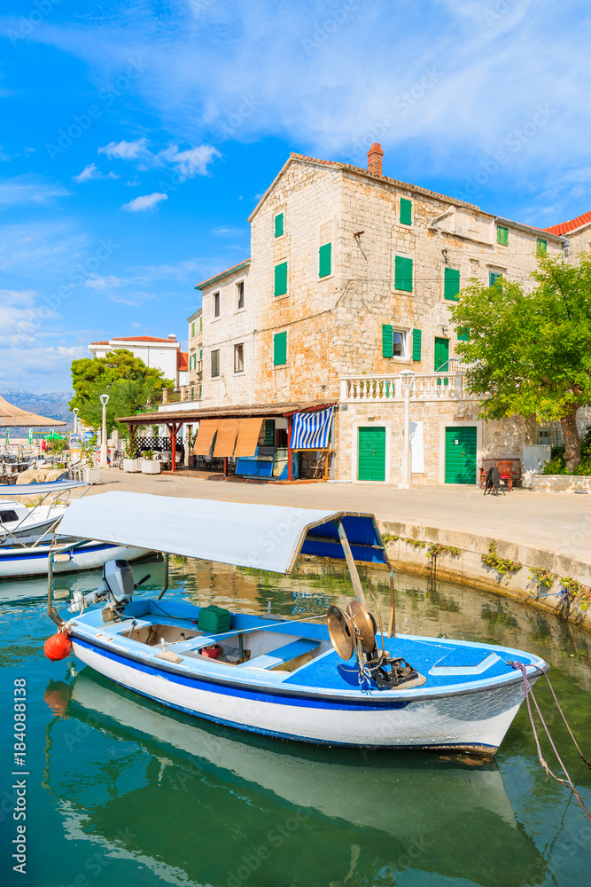 Fishing boat in Postira village with beautiful port, Brac island, Croatia