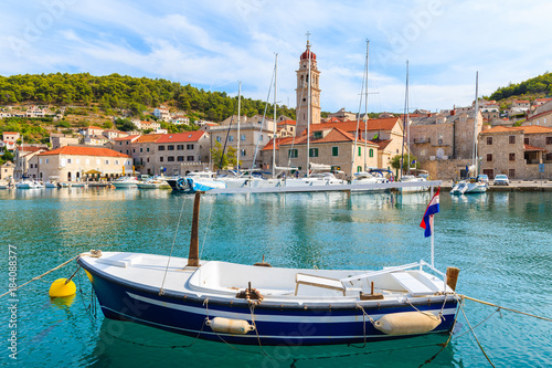 Fishing boat mooring in picturesque Pucisca port  Brac island  Croatia