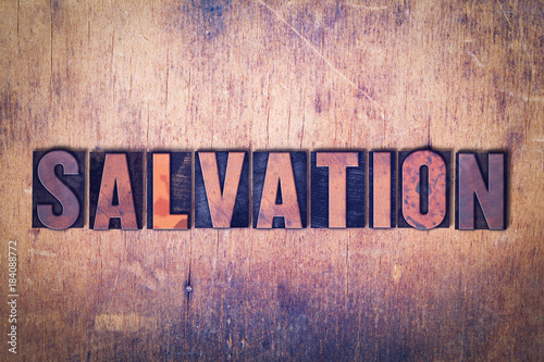 Billede på lærred Salvation Theme Letterpress Word on Wood Background