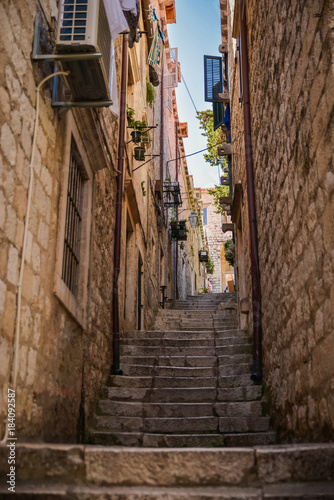 Narrow street with steps of medieval city Dubrovnik. Travel postcard vacation concept. © icephotography