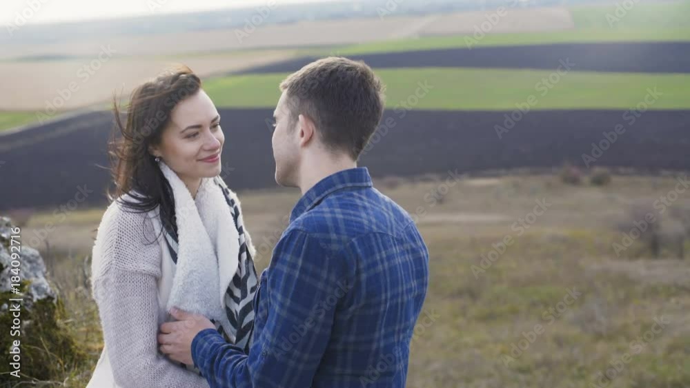 Lovely man embraces and kisses his woman on nature. 4K Lovely man embraces and kisses his woman on nature. 4K