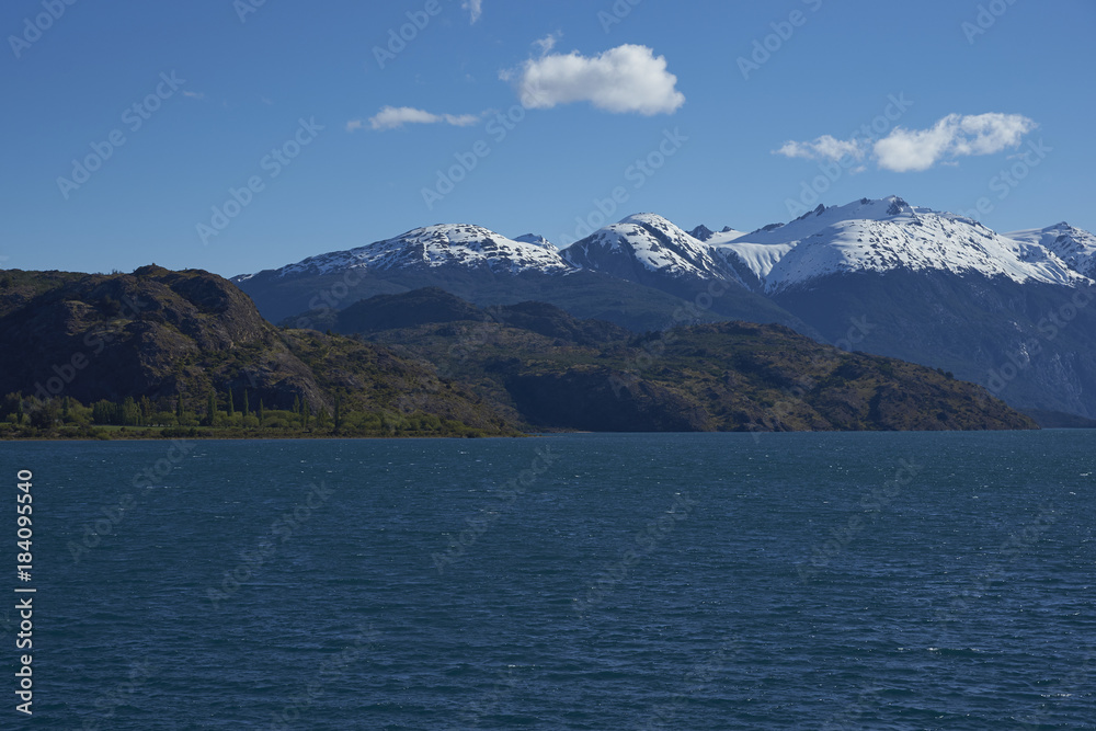Landscape along the Carretera Austral next to the azure blue waters of Lago Bertrand in Patagonia, Chile Landscape along the Carretera Austral next to the azure blue waters of Lago Bertrand in Patagonia, Chile