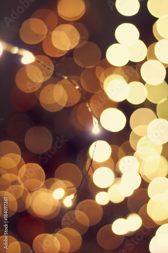 Photo of a New Year's garland abstract sparks./Beautiful Rasfokus lights of Christmas garlands. photo