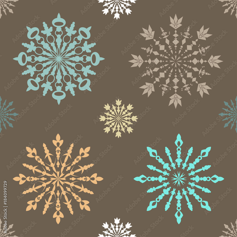 Seamless pattern with large and small blue patterned snowflakes on white background