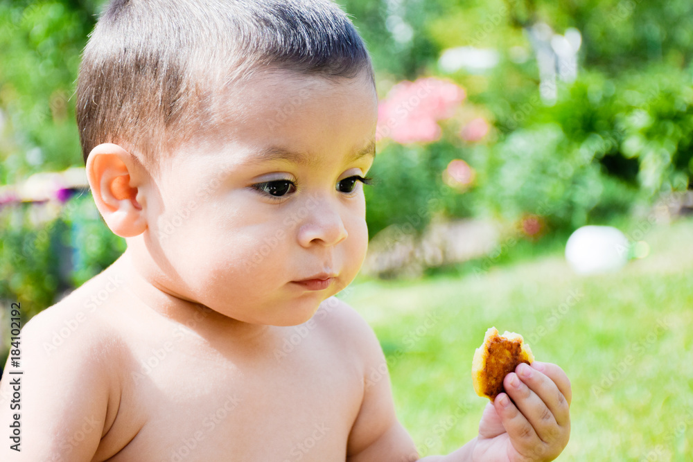 Little latin boy eating harmful fried food. Little latin boy eating harmful fried food.
