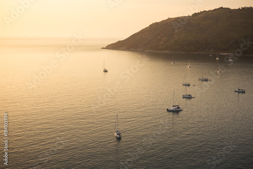 Fotografie, Obraz sailing boats in the bay at sunset, view from above, mountain in the background