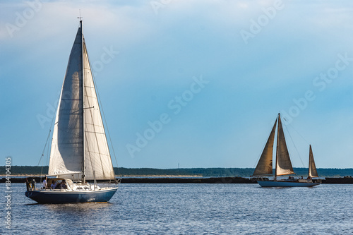 Blue sailboat at river