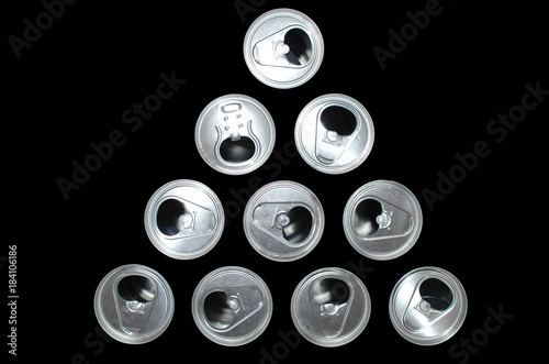 ten tin cans on a black background