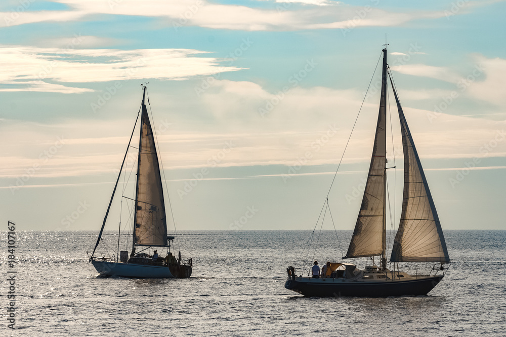 Sailboats traveling by Baltic sea Sailboats traveling by Baltic sea
