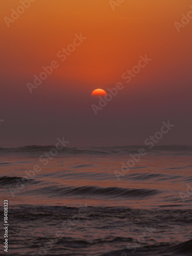 Beatiful red sunset over sea surface