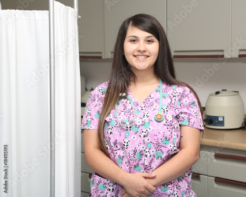 Young attractive female healthcare professional, nurse in hospital.