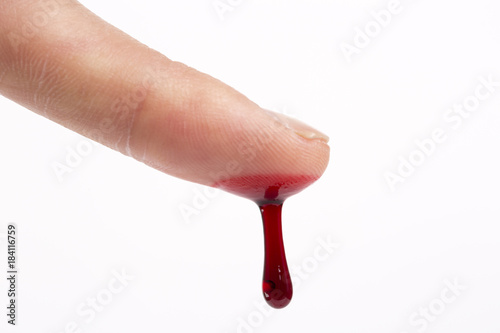 Tablou pe pânză Blood dripping from man's finger, close-up