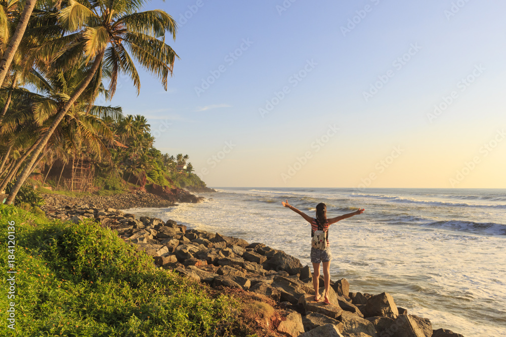 Freedom concept,one girl on the beach with beautiful view, Varkala, India