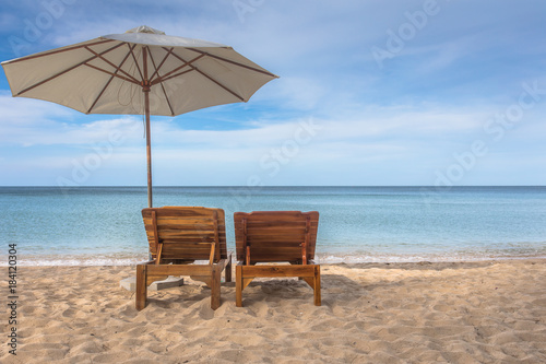 Two sun lounges on the beach