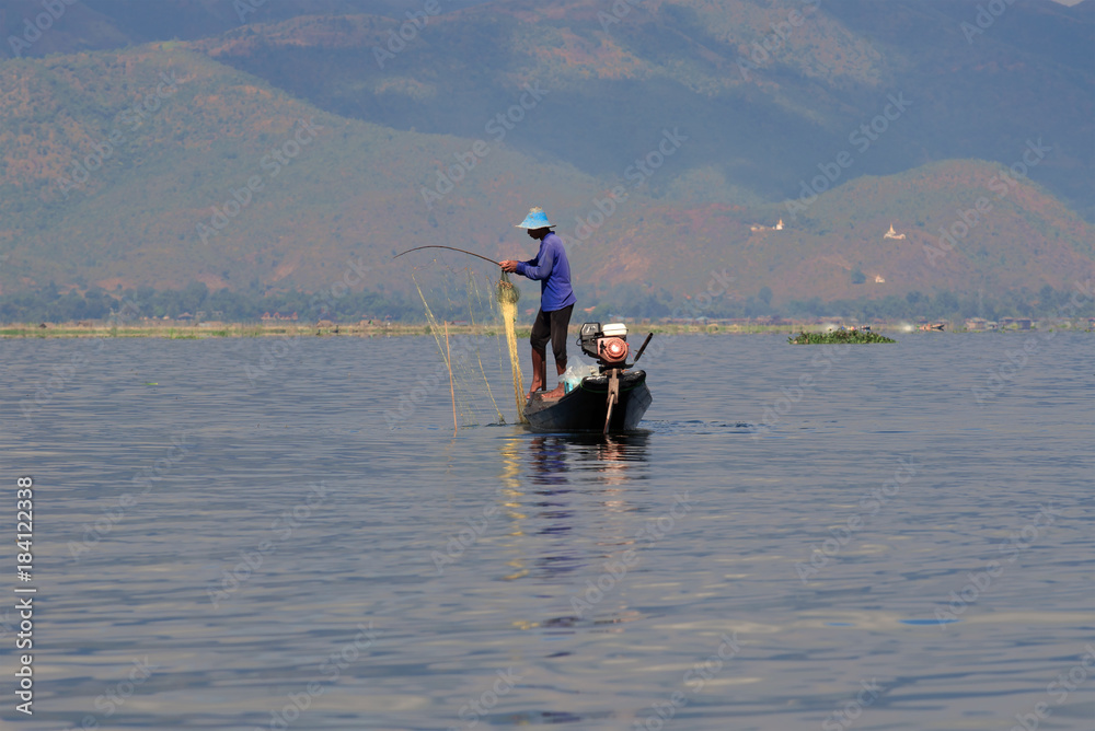 The burmese fisherman with network on the Inle lake, Myanmar