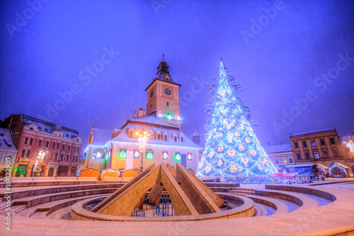 Beautiful Christmas tree near Council house in the main center square of Brasov town, Transylvania region, Romania