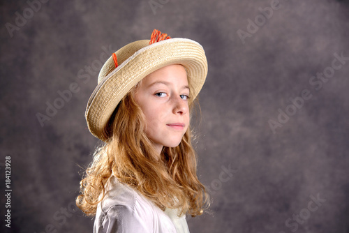blond girl in white dress and straw hat