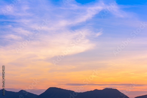 Sunset with mountain view background at countryside in Kanchanaburi province, Thailand.