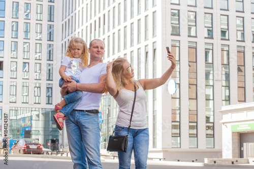 stylish young family in the same clothes for a walk