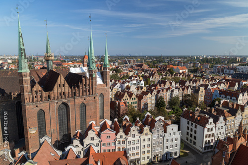 St. Mary's Church and old residential buildings at the Main Town (Old Town) in Gdansk, Poland, viewed from above on a sunny day in the summer.