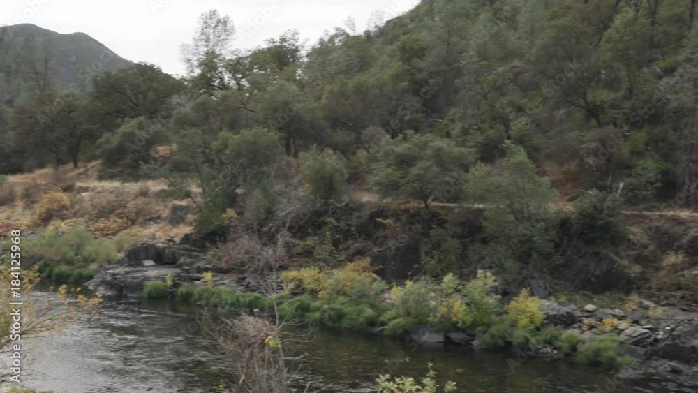 gimbal shot of teen girl standing on road near merced river gimbal shot of teen girl standing on road near merced river