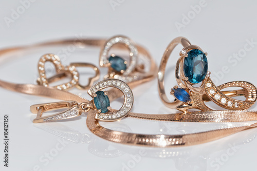 Gold earrings and ring with blue Topaz