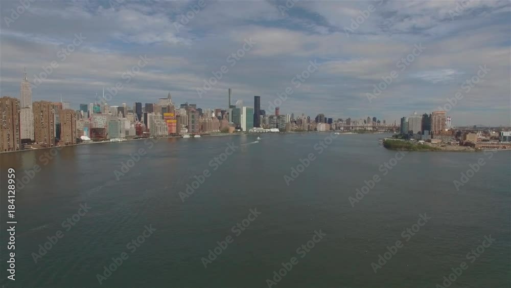 Aerial real time panoramic shot of Midtown Manhattan and Upper Manhattan. Camera is hovering in the air above East River in New York City. Aerial real time panoramic shot of Midtown Manhattan and Upper Manhattan. Camera is hovering in the air above East River in New York City.