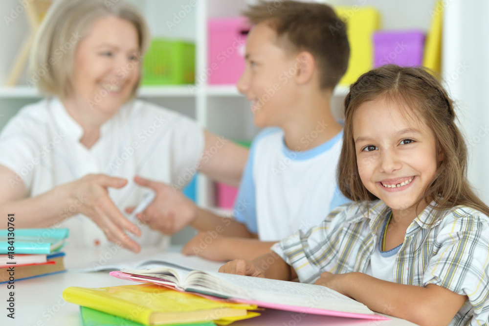 granny with grandchildren doing homework granny with grandchildren doing homework