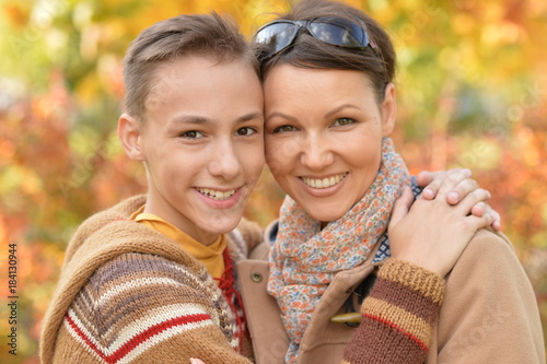 Mother with son in autumn park