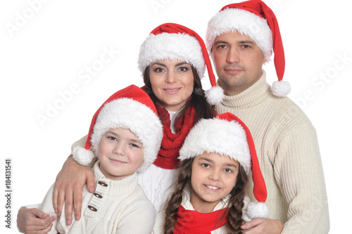 family with kids in santa hats