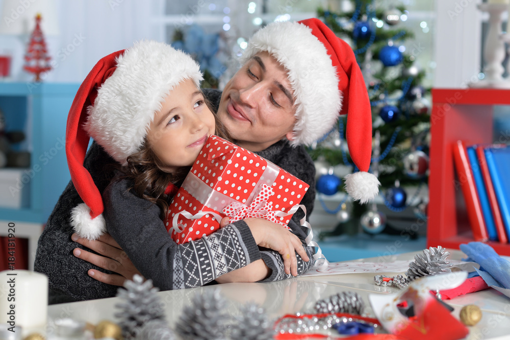 father and daughter with Christmas gift father and daughter with Christmas gift